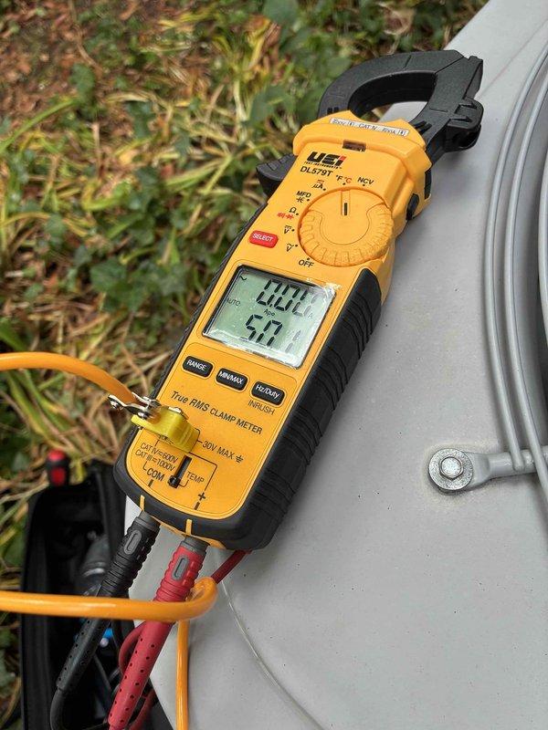 Completed cooling tune-up on residential outdoor condensing unit. Performed electrical diagnostics using clamp meter, verifying voltage and amperage readings to ensure proper system operation. All measurements were within normal operating parameters, and unit is functioning as designed.