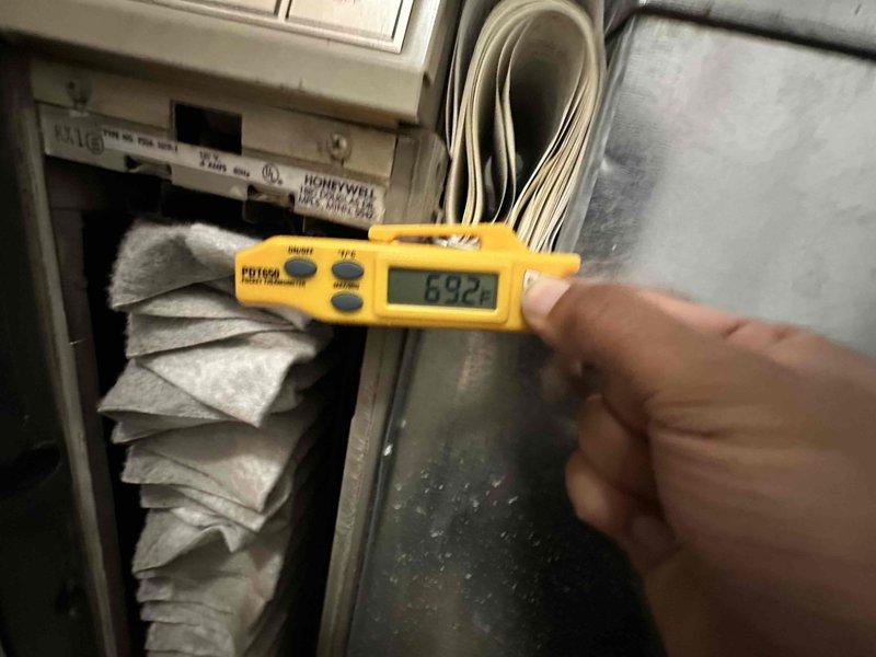 Completed scheduled preventive maintenance on residential air conditioning system. Performed diagnostic testing with digital multimeter, recording system readings at 632 to verify proper electrical operation. Inspected evaporator coil for cleanliness and airflow obstruction. Examined blower wheel assembly, which showed acceptable condition with minor dust accumulation on blades. Noted some surface corrosion on adjacent metal housing components that will require monitoring during future service visits. All system components operational and functioning within normal parameters at time of inspection.