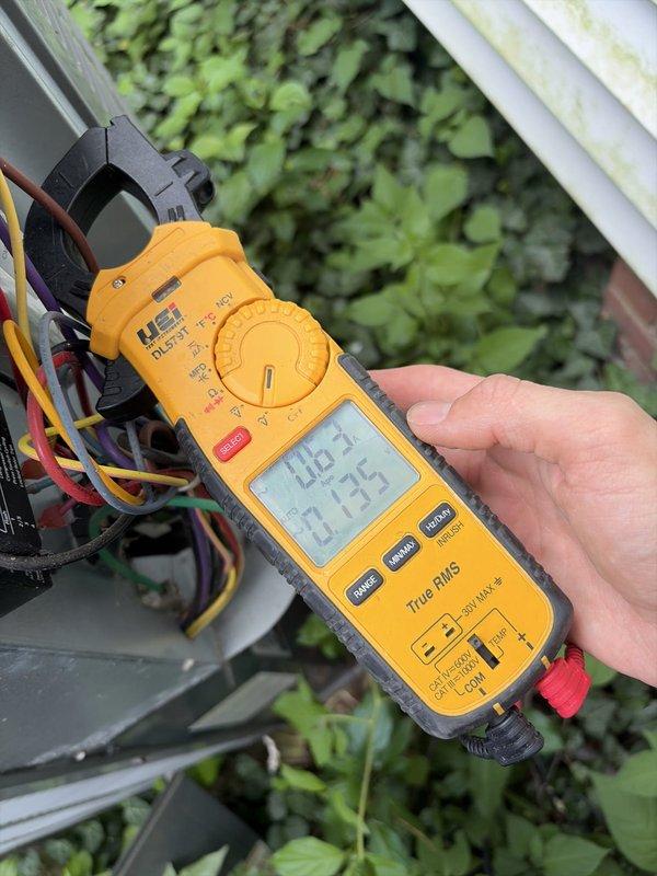Completed scheduled preventive maintenance on residential cooling system. Performed electrical diagnostics using clamp meter, recording amperage readings of 40.21A and 13.75A to verify proper compressor and system operation. Accessed unit control panel to inspect wiring connections and CoreSense diagnostic module for Copeland compressor system, confirming all electrical components functioning within normal parameters.