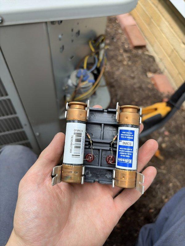 Completed comprehensive air conditioning tune-up service on residential HVAC system. Inspected and tested electrical components including fuse assembly and disconnect panel, verified proper amperage draw on condenser fan motor reading 16.40 amps, and confirmed system operational performance within manufacturer specifications.