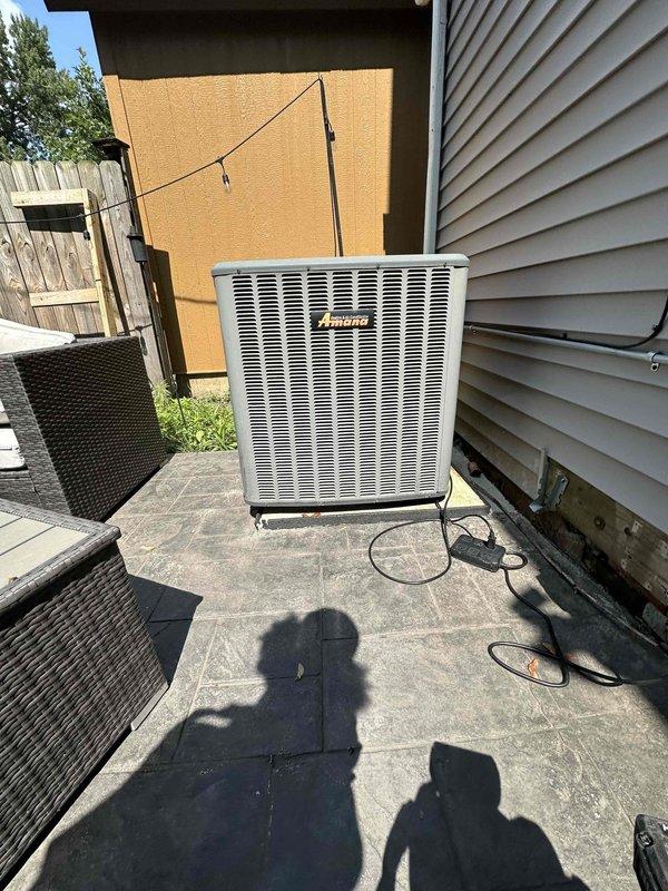 Performed routine cooling season tune-up on residential Amana air conditioning system. Inspected outdoor condenser unit, Emerson control board, and electrical connections; verified proper operation of all system components. All systems found to be functioning within normal parameters at time of service.