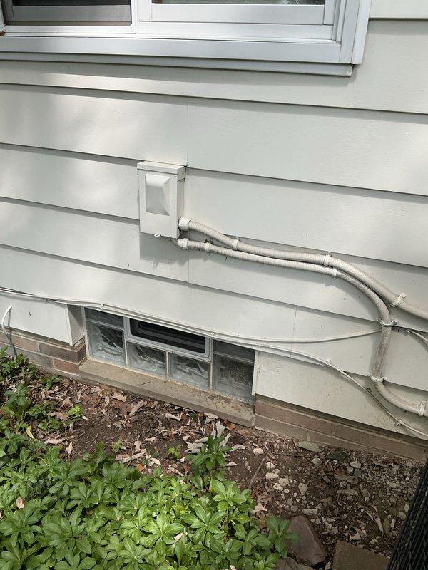 Performed comprehensive evaluation of 22-year-old residential HVAC system experiencing multiple equipment failures requiring extensive repairs. After assessing the furnace and outdoor condensing unit, presented full system replacement options to address aging equipment and avoid continued repair costs. Documented existing equipment conditions including interior furnace installation and exterior condenser with associated electrical connections and refrigerant lines.