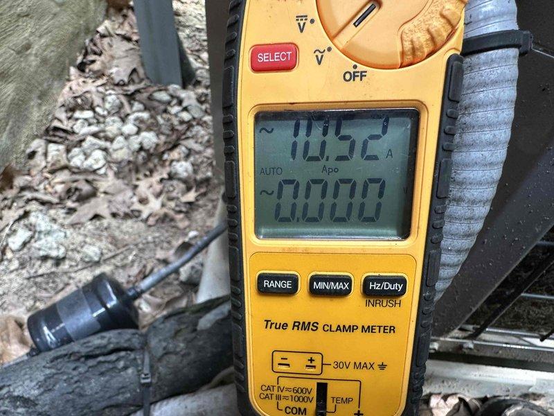 Completed comprehensive cooling system tune-up and performance evaluation. Measured and recorded operating amperage at 70.52A using calibrated clamp meter, verified electrical parameters within manufacturer specifications, and inspected condenser unit components. Noted potential corrosion concerns on exterior cabinet panels requiring future monitoring.