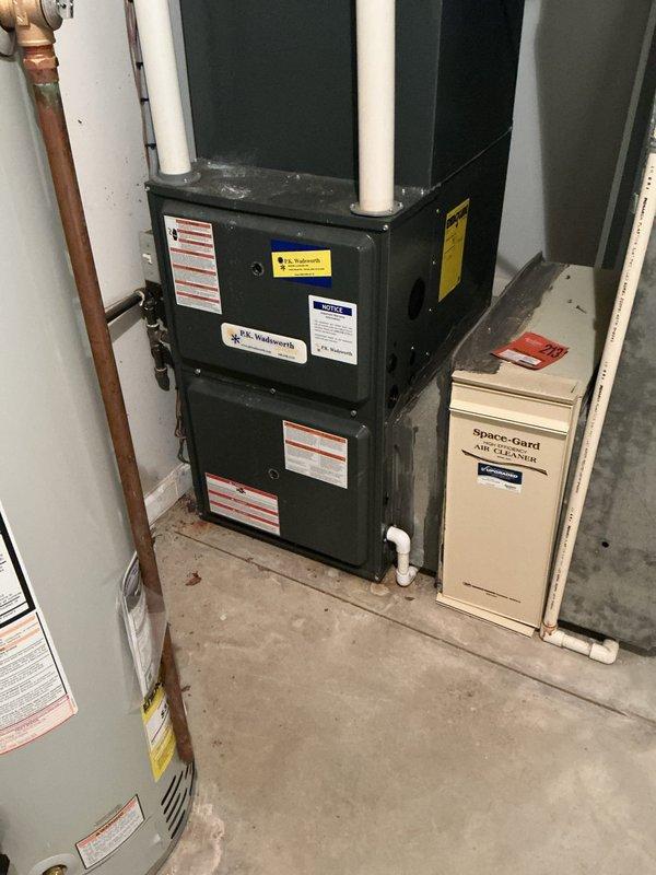 Completed routine cooling system maintenance on residential HVAC unit. Performed standard inspection of furnace and air handler components, replaced heavily soiled air filter with new pleated filter, and verified proper operation of Space-Gard air cleaner system. All equipment found in functional condition with no issues identified.