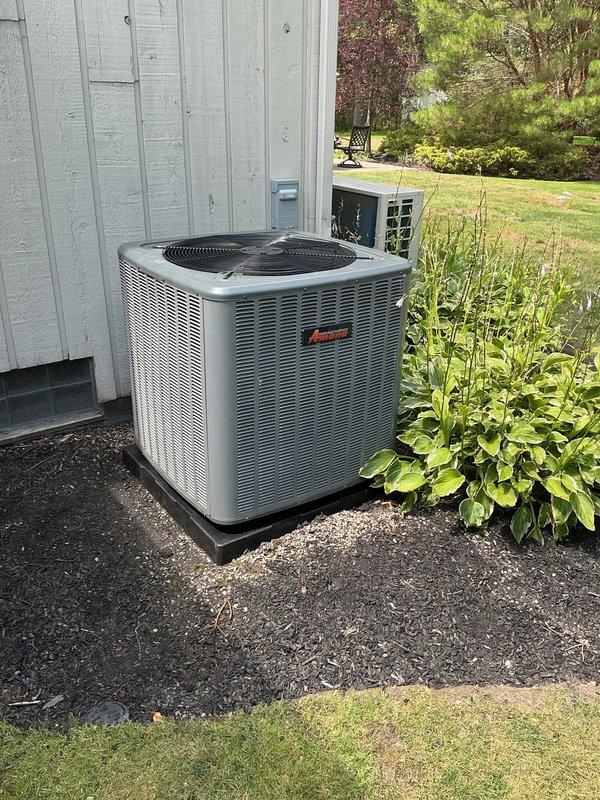 Replaced three deteriorated condenser pads for outdoor HVAC units, including an Amana air conditioning unit and a Daikin mini-split condenser system. Leveled and positioned new black rubber pads to ensure proper equipment support, drainage, and vibration isolation for all three units mounted on the building exterior.