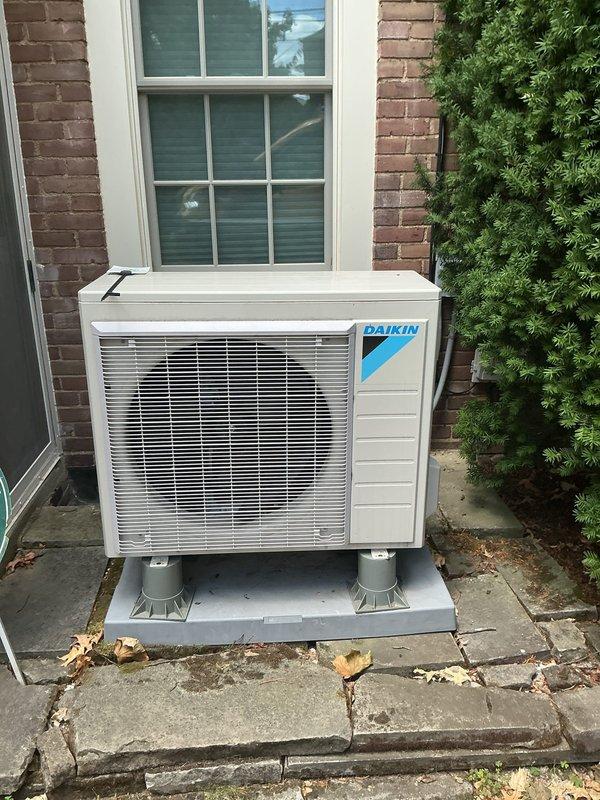 Completed scheduled preventive maintenance on residential Daikin air conditioning system. Performed comprehensive system inspection including electrical measurements with digital clamp meter, verified proper amperage draw, and confirmed unit operation. Condenser unit found in good condition with clean coils, proper clearances maintained, and secure mounting on concrete pad.
