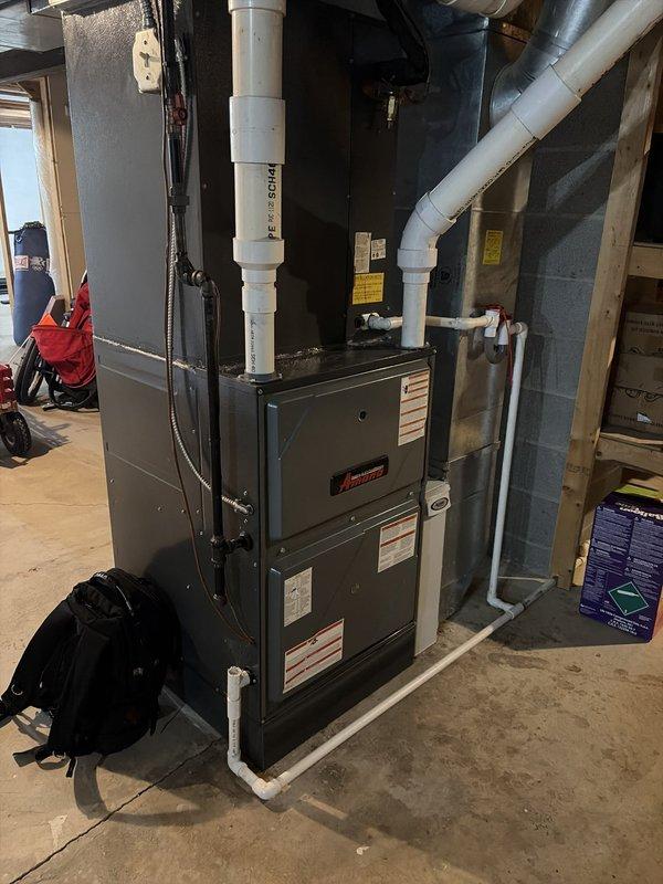 Performed scheduled cooling system maintenance on Amana furnace unit with heat pump system. Verified system operation and measured supply air temperature at 42.7°F, confirming proper cooling performance. Documented equipment condition and installation with photos for service records.