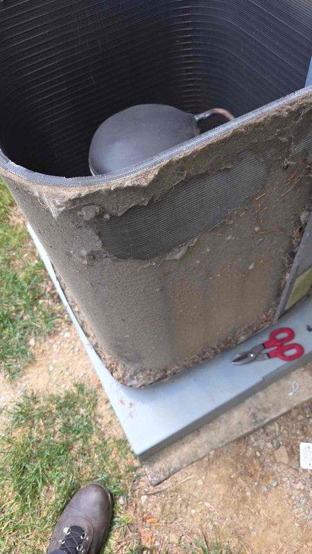 Replaced failed condenser fan motor on outdoor unit and performed thorough coil cleaning to restore proper airflow and heat transfer efficiency. Installed two compressor hard start capacitors and a surge protector to enhance system reliability and protect against electrical damage. Unit was found with significantly deteriorated exterior housing and accumulated debris, which was addressed during service to ensure optimal operation.