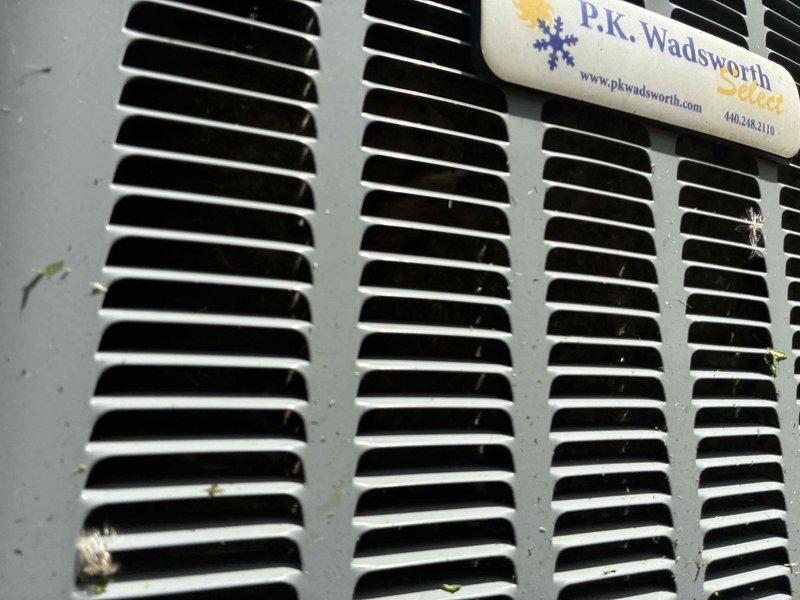 Completed routine cooling system maintenance on outdoor condensing unit. Inspected electrical components including contactor, capacitor, and control board; verified all wire connections were secure and properly terminated. Cleaned exterior louvers and grille to ensure adequate airflow through the unit. All components found in good operating condition with normal wear consistent with outdoor installation.