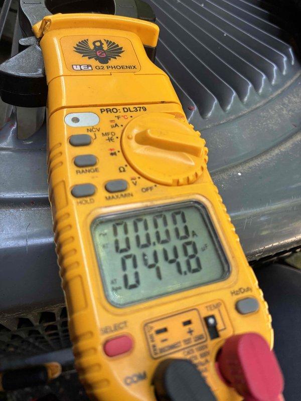 Performed non-member cooling system tune-up on residential air conditioning unit. Customer reported hearing a slight grinding noise from the outdoor unit during operation, though cooling performance remained unaffected. Conducted comprehensive system diagnostics using digital multimeter to measure electrical parameters and capacitance values. All measurements fell within normal operating ranges, and visual inspection of outdoor unit components revealed no obvious mechanical defects or loose parts. Air conditioning system continues to operate effectively with proper cooling output, though noise concern was noted for potential future monitoring.