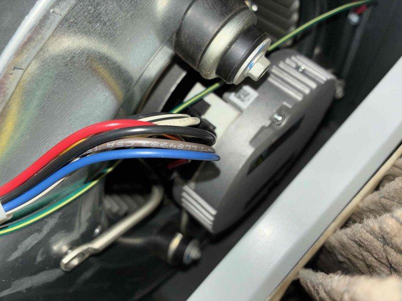 Completed routine cooling system maintenance as part of scheduled MVP recurring service. Performed comprehensive inspection of HVAC unit including examination of inducer motor assembly, electrical connections, and capacitor functionality. Verified proper wire connections with color-coded conductors (red, black, brown, blue, green, and ground), ensuring all connections were secure and properly routed. Inspected cylindrical run capacitor with yellow, purple, and red wire terminals, confirming proper mounting and operational condition with no signs of bulging, leaking, or deterioration. Checked blower assembly housing and motor components for proper operation and heat signatures. All electrical connections tested and found secure with appropriate cable management in place. System operating within normal parameters upon completion of maintenance visit.