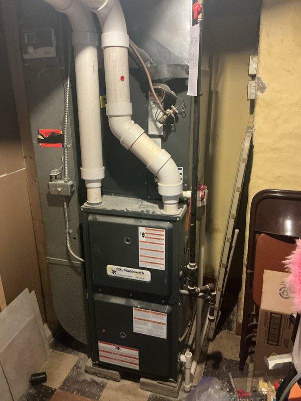 # HVAC Cooling System Maintenance Completed

Performed comprehensive cooling system maintenance on residential split HVAC system. Inspected indoor furnace unit located in basement mechanical room, verifying proper operation of blower assembly and checking all electrical connections at service panel. Examined PVC condensate drain lines for proper pitch and drainage, ensuring no blockages present. Assessed refrigerant line insulation integrity along copper line set.

Proceeded to outdoor condenser unit for external inspection and maintenance. Verified condenser unit level on concrete pad with no settling observed. Cleaned condenser coils and checked fan motor operation. Inspected electrical disconnect and refrigerant line connections at unit. Confirmed proper airflow through condenser louvers with adequate clearance from surrounding vegetation. All system components operating within normal parameters. System ready for continued cooling season operation.