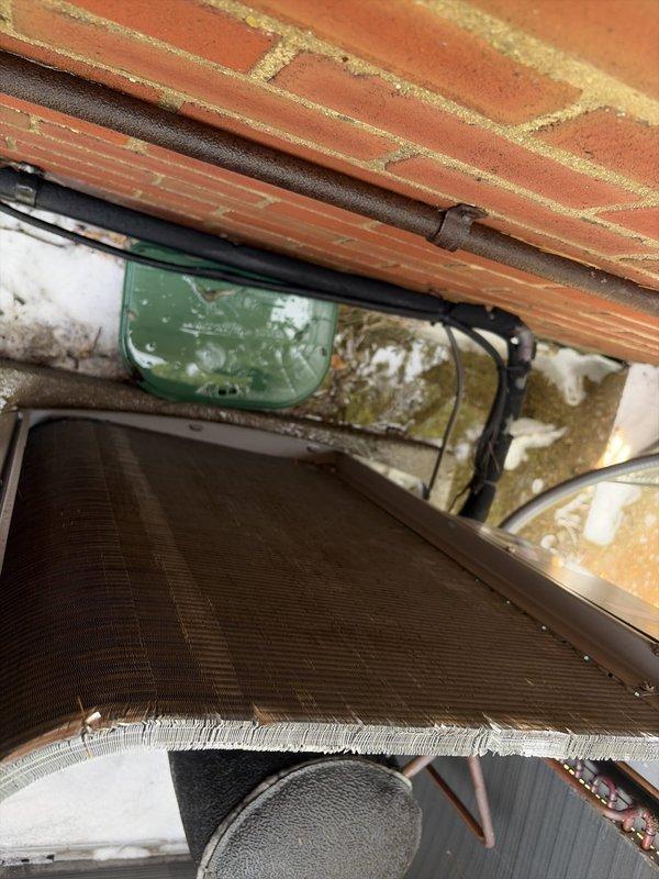 Performed deep cleaning of outdoor condenser coil to remove accumulated debris, dust, and organic matter that had built up between the aluminum fins, which was restricting airflow and reducing system efficiency. Replaced failed dual-run capacitor with new 45/10 MFD unit to restore proper compressor and condenser fan motor operation.