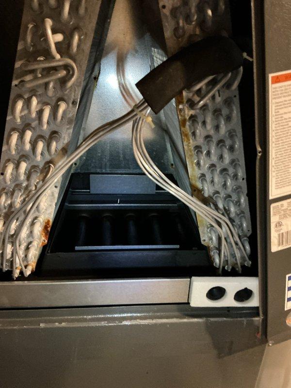 Replaced failed evaporator coil drain pan on air handler unit. Removed old corroded pan showing signs of rust and deterioration, installed new drain pan assembly, and verified proper drainage operation. System tested and confirmed operational with no leaks detected.