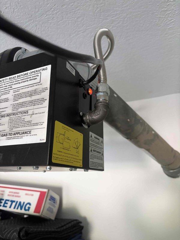 Completed garage heater replacement with new unit properly mounted to ceiling structure. Removed existing heater and returned old unit same day for credit as requested. New heater installed with appropriate venting, electrical connections secured, and all safety labels verified in place for code compliance.