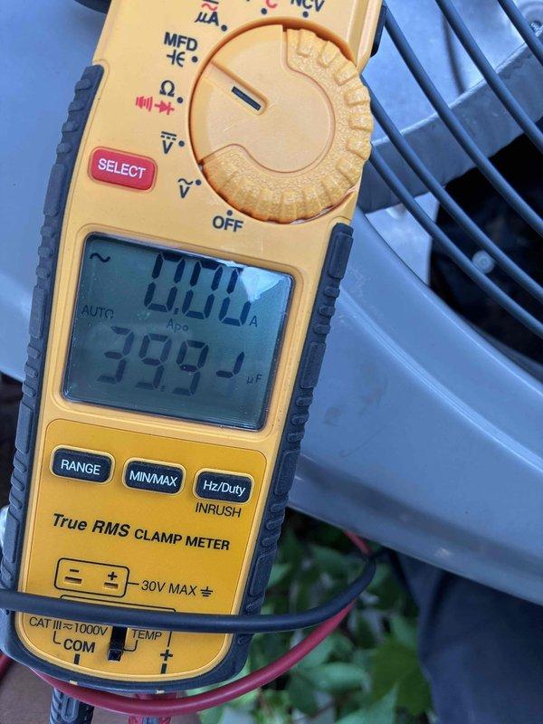 Completed scheduled preventative cooling maintenance on residential air conditioning system. Performed electrical diagnostics using clamp meter, recording amperage draws and capacitance readings of 399.4 µF to verify compressor and motor performance within manufacturer specifications. Inspected interior mechanical components, identifying surface corrosion and debris accumulation on mounting surfaces and connections requiring monitoring for future service intervals. All system measurements confirmed unit operating normally at time of service.