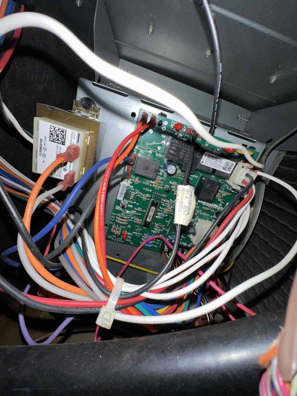# HVAC Cooling Maintenance Summary

Completed routine preventive maintenance on residential air conditioning system as part of ongoing service agreement. Performed comprehensive inspection of control board assembly, verifying proper operation of all electronic components, connections, and wiring harnesses. Confirmed electrical service disconnect functionality and accessibility for safe system operation.

# Detailed Work Performed

Conducted thorough cooling season maintenance inspection on residential HVAC system. Accessed and examined the main control board assembly housed within the air handler cabinet. Verified integrity of the green circuit board, inspecting all integrated circuits, surface-mounted components, and connector ports for signs of wear, corrosion, or thermal damage. All electronic components appeared in proper working condition with no visible deterioration.

Inspected multi-conductor wiring harness connected to control board, confirming secure connections at all termin