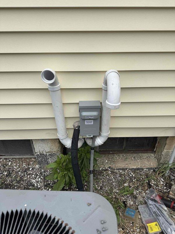 Returned to site to complete replacement of failed electrical disconnect and fuse for outdoor HVAC system. Installed new Hughes service disconnect box on exterior wall, ensuring proper mounting and weatherproofing. Replaced blown fuse and verified electrical connections to condenser unit. Tested system operation and confirmed proper voltage and amperage at disconnect. Unit cycling normally with all safety controls functioning as designed.