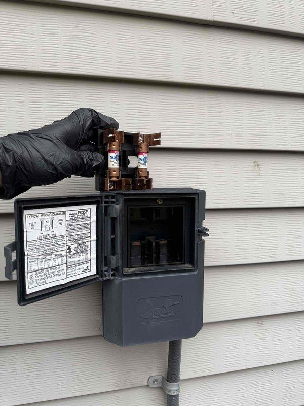 Performed comprehensive cooling season tune-up on residential HVAC system. Conducted electrical safety inspection including disconnect box examination and fuse assembly verification, tested capacitor functionality and voltage readings using digital multimeter, and confirmed all electrical connections were secure. System operating within normal parameters upon completion of preventative maintenance service.