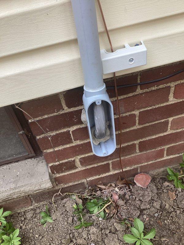 Replaced 100-amp exterior electrical service disconnect to bring installation into full compliance with current National Electrical Code requirements. Removed outdated disconnect equipment and installed new weatherproof metal enclosure with proper fuse holders, insulators, and terminal connections. Configured all electrical connections through code-compliant gray PVC conduit system with appropriate mounting brackets secured to building exterior, ensuring proper weatherproofing and protection of all electrical components.
