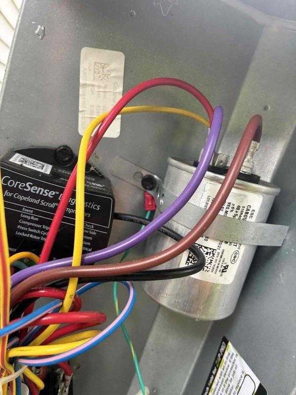 # HVAC Cooling Maintenance Summary

Completed routine preventive maintenance on residential cooling system under ongoing service plan agreement. Inspected evaporator coil assembly and honeycomb filter pad, confirming proper airflow and structural integrity of mounting frame. Examined electrical control panel components including capacitor, CoreSense compressor protection module, and associated relay systems, verifying all wire connections were secure and components operating within specifications.

# Detailed Work Performed

Conducted comprehensive cooling system maintenance inspection beginning with the air handling unit. Examined the evaporative cooling pad assembly, noting the honeycomb-structured filter media remained in serviceable condition with adequate cellular structure intact for proper air distribution. Verified mounting frame integrity and confirmed flexible condensate line was properly secured with appropriate hardware to prevent displacement during operation.

Proceeded t