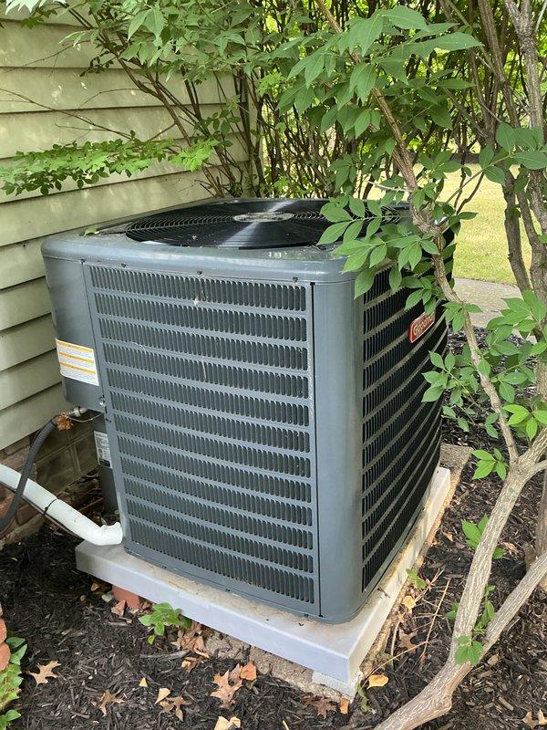 Completed comprehensive cooling season tune-up on residential air conditioning system. Performed visual inspection of outdoor condenser unit, verified electrical connections and contactor operation, checked capacitor functionality, and confirmed proper system operation. Unit found in satisfactory working condition with normal seasonal debris accumulation around base.