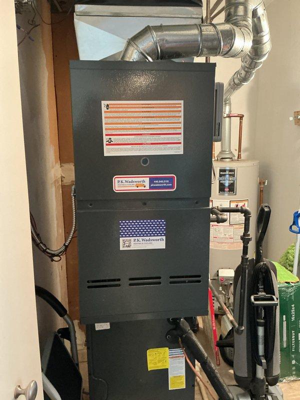 Completed cooling tune-up on residential HVAC system. Inspected furnace unit and associated components, verified system operation, and measured supply register temperature at 249.8°F. All equipment found to be functioning within normal parameters with no issues identified.