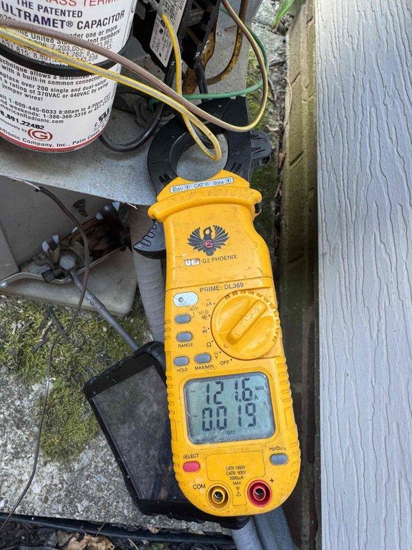 # HVAC Maintenance - Cooling System 10+ Years Old

Performed comprehensive preventive maintenance on an aging outdoor condensing unit. Conducted thorough inspection of all major components including compressor, condenser fan motor, and electrical systems. Removed and cleaned condenser coil to restore optimal heat transfer efficiency.

Performed electrical diagnostics using digital multimeter to verify proper voltage and amperage readings at the capacitor and compressor terminals. Measured capacitor performance to ensure adequate starting and running capabilities for the compressor and fan motor. All electrical connections were inspected for signs of wear, corrosion, or loose terminations.

Utilized infrared temperature measurement device to assess refrigerant system performance and verify proper heat rejection at the condenser coil. Checked fan motor operation and blade condition for proper airflow across the coil. Inspected refrigerant line insulation and verified all connections were