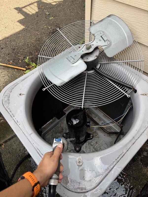 # HVAC Maintenance - Cooling System 10+ Years Old

Performed comprehensive preventive maintenance on an aging outdoor condensing unit. Conducted thorough inspection of all major components including compressor, condenser fan motor, and electrical systems. Removed and cleaned condenser coil to restore optimal heat transfer efficiency.

Performed electrical diagnostics using digital multimeter to verify proper voltage and amperage readings at the capacitor and compressor terminals. Measured capacitor performance to ensure adequate starting and running capabilities for the compressor and fan motor. All electrical connections were inspected for signs of wear, corrosion, or loose terminations.

Utilized infrared temperature measurement device to assess refrigerant system performance and verify proper heat rejection at the condenser coil. Checked fan motor operation and blade condition for proper airflow across the coil. Inspected refrigerant line insulation and verified all connections were