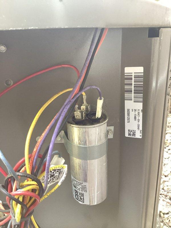 Completed cooling tune-up on two HVAC units. Inspected electrical components including capacitors, contactors, and associated wiring connections on both systems. All components found in good working condition with proper wire connections and terminal security verified.