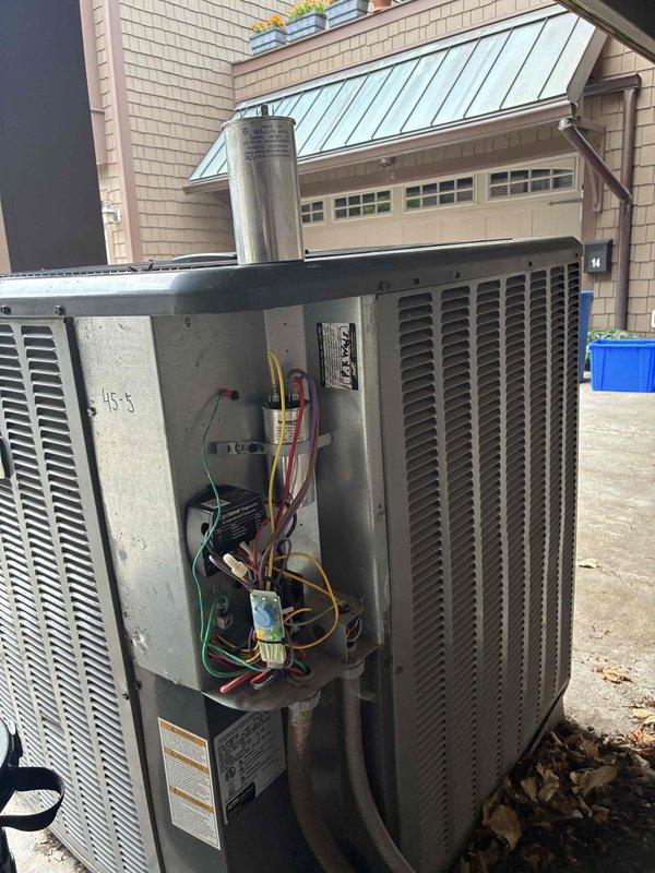 # HVAC Cooling Maintenance - 10+ Years Old Unit

Performed comprehensive cooling maintenance on aging residential HVAC system located on exterior concrete pad. Conducted thorough inspection of electrical components, wiring connections, and internal systems with access panel removed for detailed assessment.

## Work Performed

Inspected all electrical wiring and terminal connections, including power supply wires, control wiring, and capacitor connections. Verified proper wire routing and secure connections throughout the electrical compartment. Examined capacitor for signs of bulging, leaking, or deterioration common in older units. Checked all wire terminals and connectors for corrosion, looseness, or heat damage.

Evaluated internal motor components and associated wiring harnesses. Inspected wire management and securing methods, ensuring proper strain relief and routing to prevent chafing or contact with moving parts. Assessed condition of electrical housing and framework for weatheri