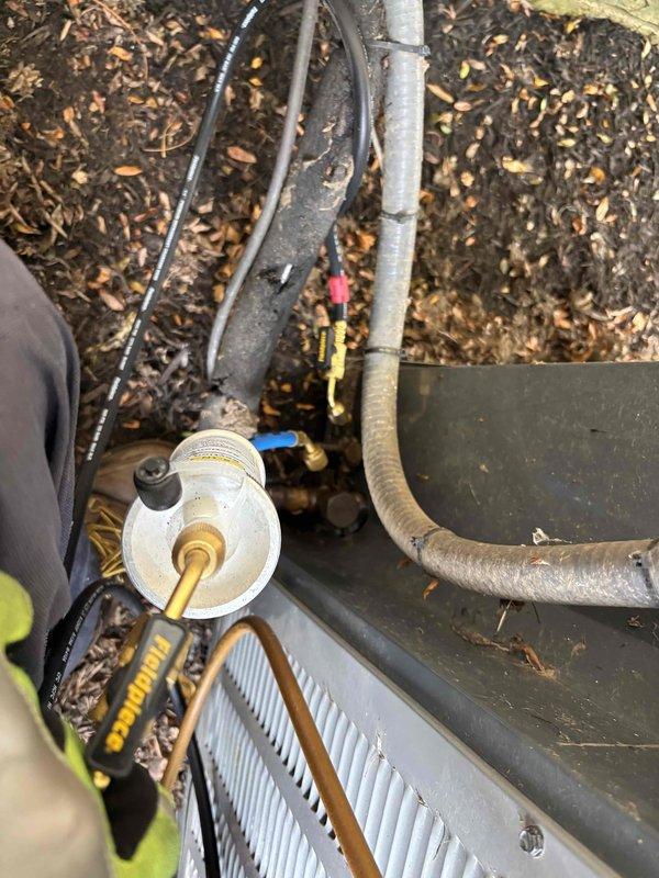 Performed AC renewal service on outdoor condensing unit. Connected manifold gauge set to measure system pressures and verify refrigerant charge levels. Completed comprehensive maintenance including system diagnostics and performance verification to ensure proper operation of the air conditioning system.