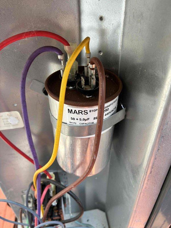 Completed comprehensive cooling system tune-up service including thorough inspection of blower assembly and electrical components. Inspected dual-run capacitor (50+5µF, 370V) with proper wire connections and verified blower wheel operation, noting dust accumulation on fan blades typical of normal system use.