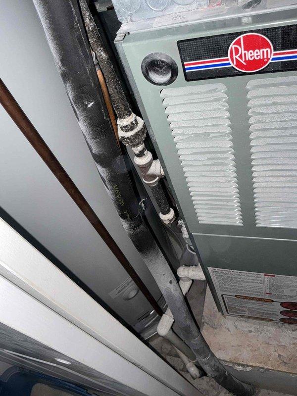 Performed comprehensive evaluation of 1998 HVAC system showing significant age-related deterioration, including worn refrigerant line insulation with visible residue buildup and overall system decline. Provided full replacement estimate with complete options for new heating and cooling equipment to address the failing 26-year-old Rheem unit and associated components.