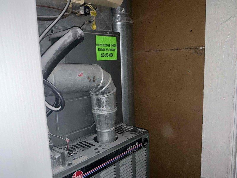 Performed comprehensive evaluation of 1998 HVAC system showing significant age-related deterioration, including worn refrigerant line insulation with visible residue buildup and overall system decline. Provided full replacement estimate with complete options for new heating and cooling equipment to address the failing 26-year-old Rheem unit and associated components.