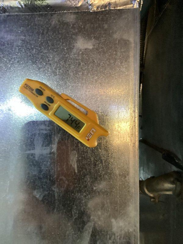 Performed routine HVAC cooling system maintenance inspection. Conducted temperature diagnostics of air handler unit, recording operating temperatures at 70.4°F. Inspected and evaluated evaporative cooling pad filter, which showed clean condition with proper mesh integrity and correct installation orientation in housing unit.
