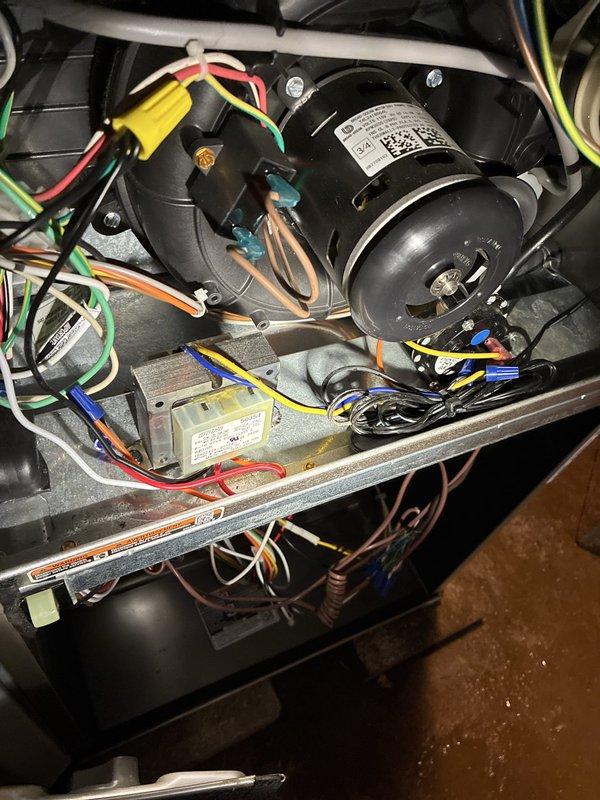 Completed commercial mini-split installation with integrated air scrubber system and dedicated electrical circuit. All components installed, wired, and tested with control system operational and displaying proper LED indicators, confirming system functionality.