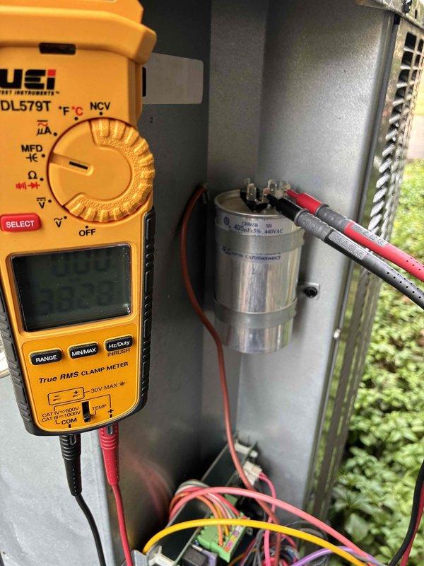 Performed comprehensive cooling system tune-up and diagnostics. Conducted electrical testing of the capacitor using a digital multimeter to verify proper voltage and capacitance values, ensuring optimal compressor and fan motor operation. All components tested within manufacturer specifications and system confirmed operational for the cooling season.