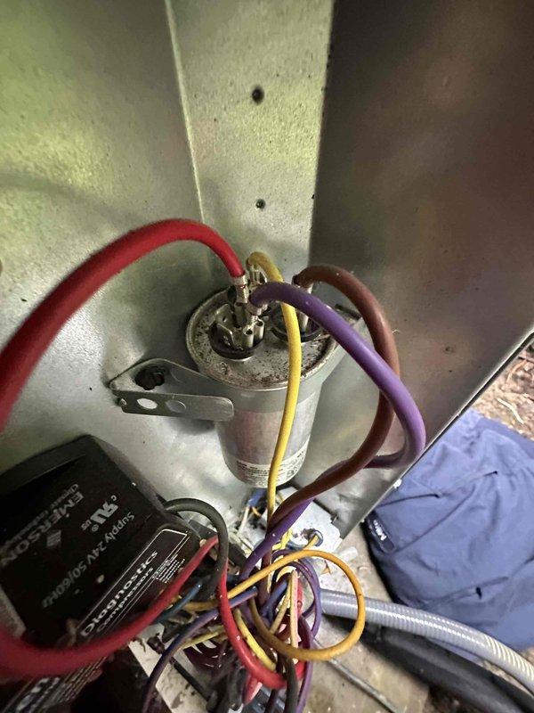 Performed routine air conditioning tune-up and system inspection. Checked electrical connections, tested capacitor functionality, and verified proper voltage at control board terminals. Exterior condensing unit inspected and found operational with normal wear consistent with age; all components functioning within acceptable parameters at time of service.