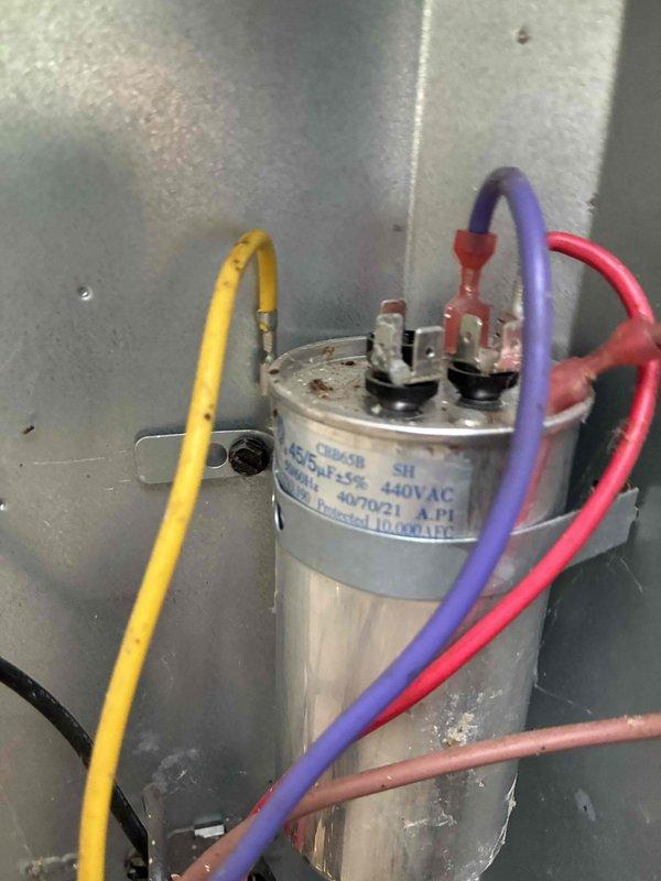 Performed routine cooling maintenance on two HVAC systems at residential property. Inspected outdoor condensing units, verified proper operation of dual-voltage capacitors, and checked all electrical connections for secure termination. Documented equipment condition through photographic records showing capacitor specifications and outdoor unit installation, confirming both systems operational and ready for continued service.