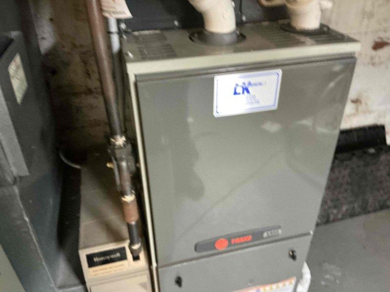 Provided comprehensive furnace replacement options for existing HVAC system in basement utility area. Evaluated current air handler configuration with PVC venting and documented equipment condition, surrounding infrastructure including copper refrigerant lines, and installation space parameters to develop appropriate replacement recommendations.