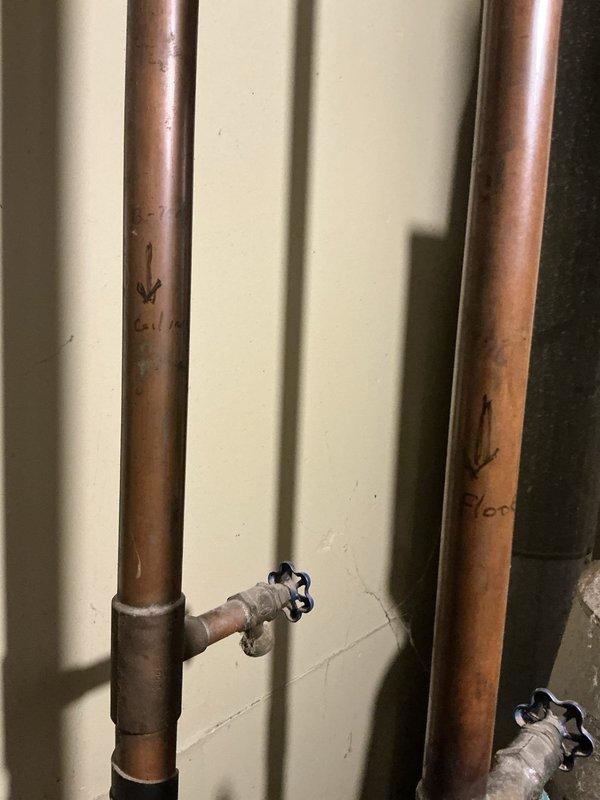 Conducted on-site assessment for boiler replacement and associated electrical work. Evaluated existing copper supply and return piping with shut-off valves, documented current electrical connections and conduit routing in mechanical space, and photographed existing system configuration to prepare comprehensive replacement estimate.