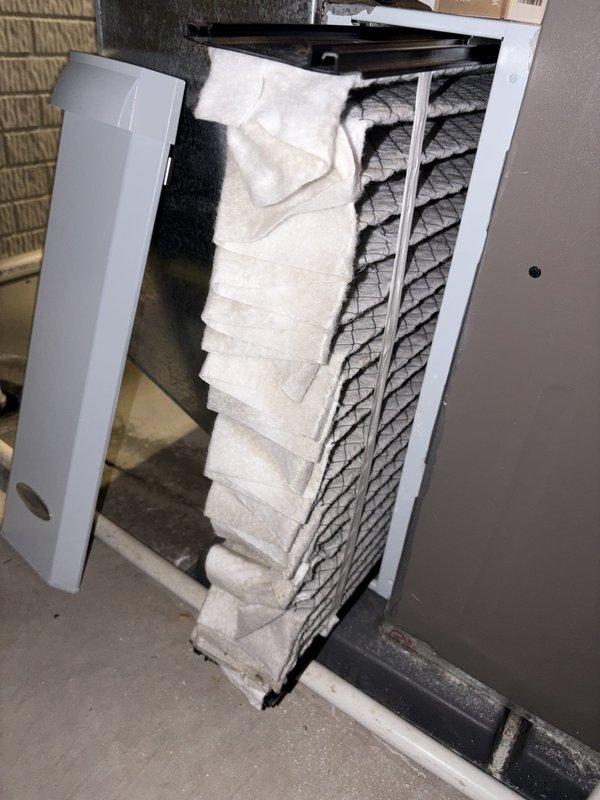 # HVAC Cooling Maintenance Summary

Performed scheduled preventive maintenance on York brand cooling system. Upon inspection, discovered significant ice accumulation on evaporator coil assembly, indicating restricted airflow or potential refrigerant issue requiring immediate attention and system defrost before completing standard maintenance protocol.

---

# Detailed Work Performed

Arrived on-site to perform routine cooling season maintenance on residential York HVAC system located in basement utility area. Conducted initial visual inspection of furnace unit, associated ductwork, electrical connections, and condensate drain lines.

Removed access panel to inspect evaporator coil and discovered extensive ice buildup completely covering the coil assembly. The frost accumulation extended across the entire pleated surface from top to bottom, severely restricting airflow and compromising system efficiency. This condition indicates one or more underlying issues: restricted airflow due to d