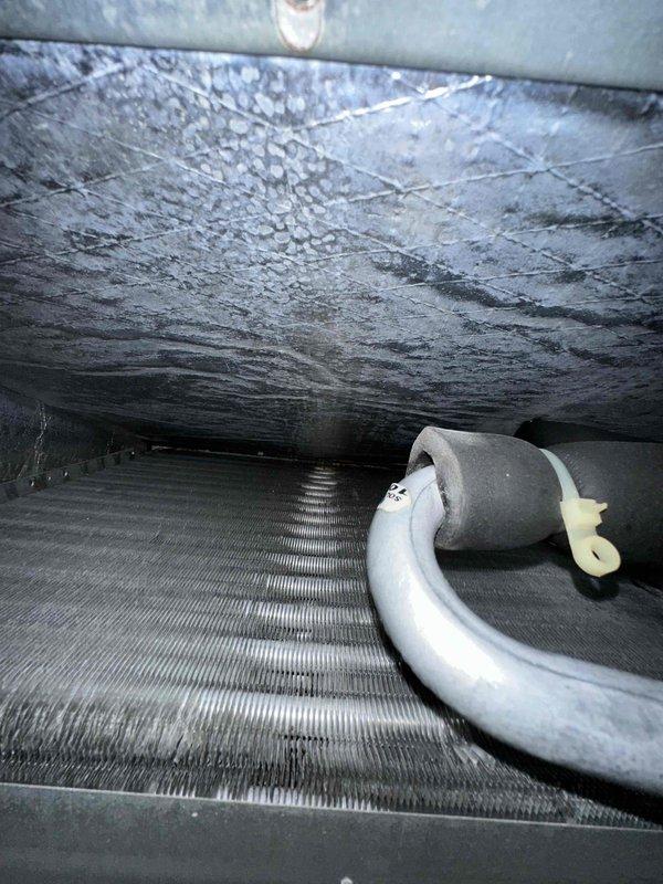 Completed scheduled preventive maintenance on residential cooling system. Upon inspection, discovered significant frost and ice accumulation on evaporator coil, indicating restricted airflow or potential refrigerant issue. Documented system temperatures with digital gauge reading 66.5°F at supply duct. Performed standard maintenance protocol including visual inspection of all accessible components, ductwork connections, and drain pan assembly.