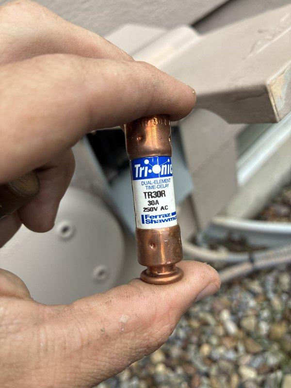 Replaced failed 30-amp Tri-onic dual-element time-delay fuse (model TR30R, 250V AC) on Daikin outdoor condensing unit model ALXS6BA3010AA. Unit restored to proper operation with correct amperage protection per manufacturer specifications.
