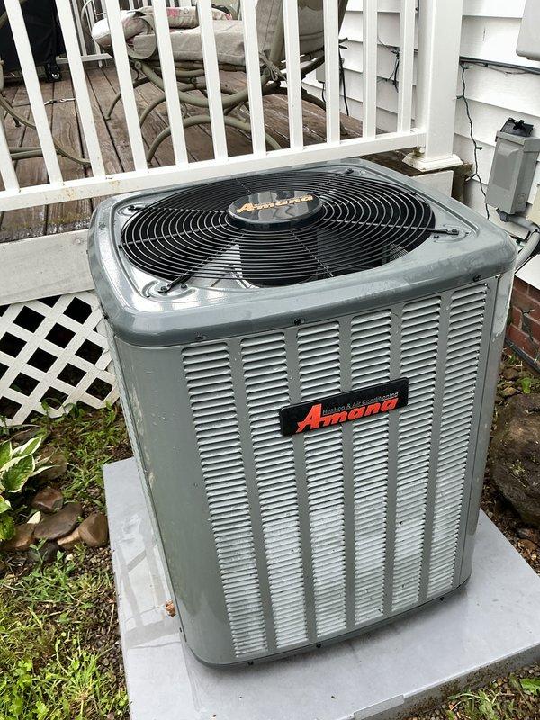 Completed scheduled preventative maintenance on residential Amana air conditioning system. Inspected outdoor condenser unit, verified proper operation of fan motor and compressor, checked refrigerant levels, and cleaned condenser coils. Examined indoor plumbing connections and shutoff valves in mechanical closet for any signs of leaks or moisture issues that could affect system performance. All components found operating within normal parameters with no immediate service needs identified.