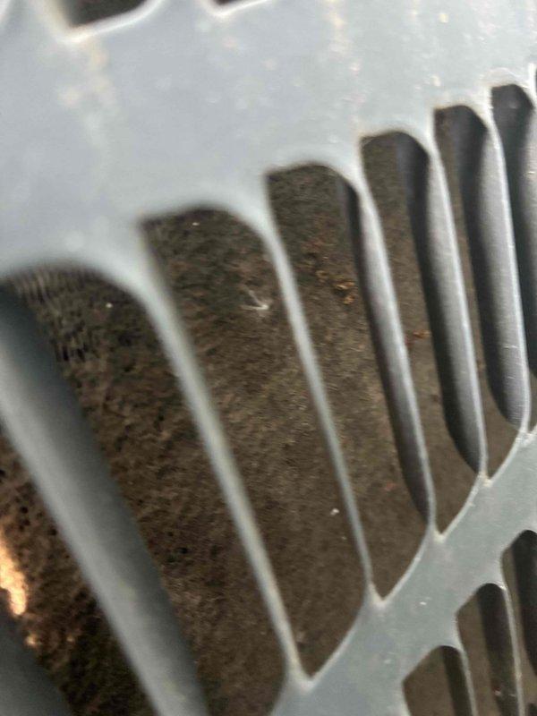 Responded to service call for non-operational air conditioning system affecting whole-house cooling. Upon arrival, performed diagnostic inspection of 4-year-old outdoor condensing unit. Visual examination revealed heavily soiled condenser coil with significant accumulation of dirt, dust, and debris lodged between fins, restricting proper airflow and heat transfer capability. Thoroughly cleaned condenser coil using appropriate methods to remove buildup and restore optimal fin spacing and airflow. Verified system operation and proper cooling function upon completion. Unit restored to normal operating condition.