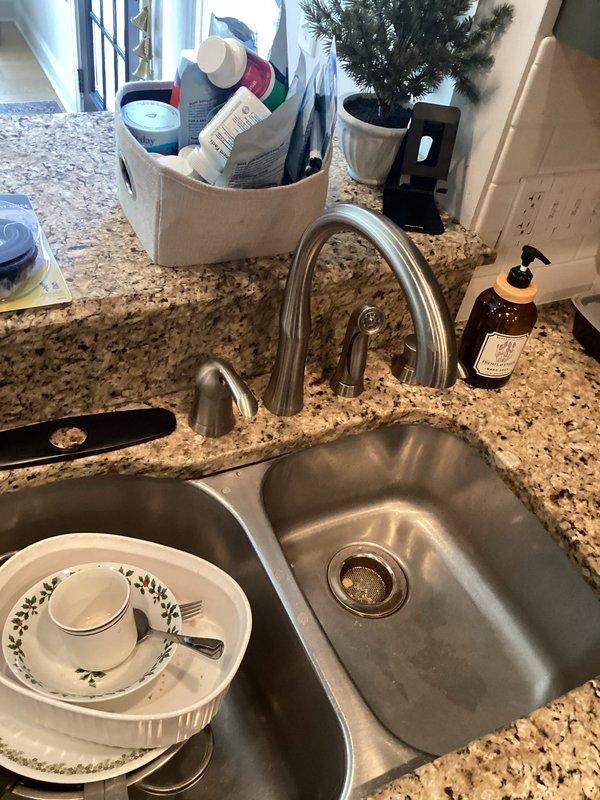 Replaced defective Delta shower cartridge in bathroom to restore proper temperature control and water flow. Installed new Moen kitchen faucet to replace worn fixture, completing all connections and testing for proper operation and leak-free performance.