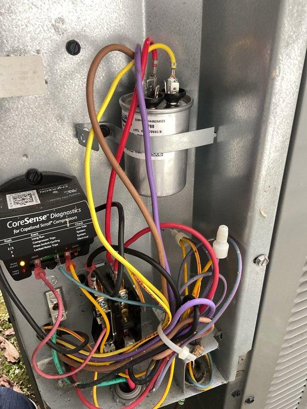 Completed routine maintenance on aging Carrier cooling system. Inspected electrical compartment components including CoreSense Diagnostics module and capacitor, verified all wire connections secure, and confirmed proper operation of compressor monitoring system. All equipment functioning within normal parameters at time of service.