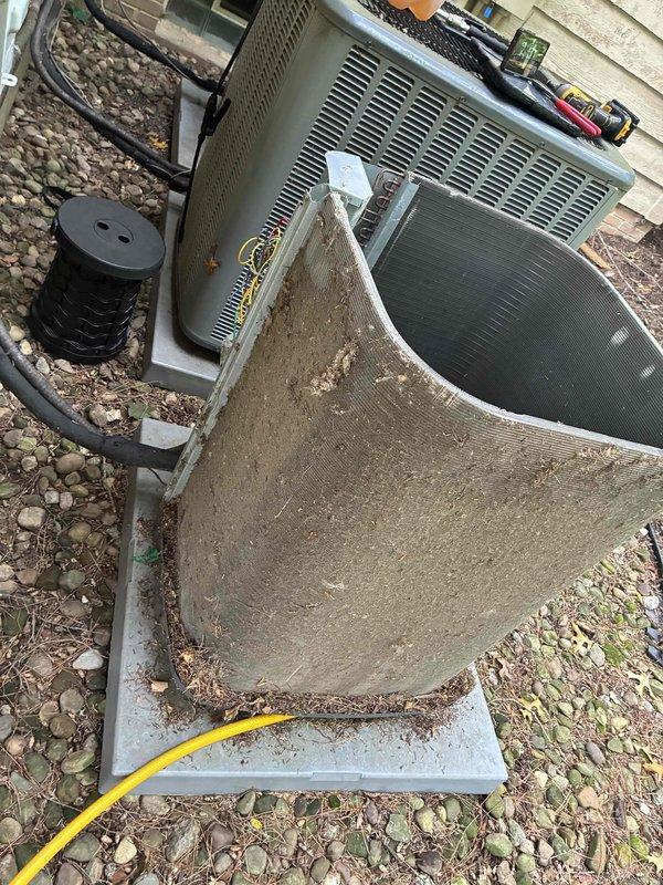 # HVAC Service Completed

Performed deep coil cleaning on three outdoor condenser units exhibiting heavy accumulation of dirt, dust, debris, and environmental contaminants that had significantly reduced airflow efficiency and heat transfer capacity. Coil fins displayed substantial brownish-green discoloration with embedded plant material and particulate matter throughout the fin assemblies. Completed comprehensive maintenance service on all three units following the coil cleaning to ensure optimal system performance and efficiency.